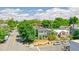 A beautifully landscaped home with mature trees, a charming fence, and inviting curb appeal at 2098 N Clarkson St, Denver, CO 80205