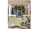 A charming front entrance of the home with classic architectural details and inviting steps at 2098 N Clarkson St, Denver, CO 80205