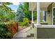 A lovely front porch view showing the lush landscaping and a charming walkway at 2098 N Clarkson St, Denver, CO 80205