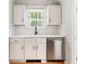 Bright, updated kitchen with white cabinets, quartz countertops, subway tile backsplash, and stainless steel appliances at 2098 N Clarkson St, Denver, CO 80205