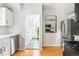 Contemporary kitchen featuring stainless steel appliances, white cabinetry, and modern finishes at 2098 N Clarkson St, Denver, CO 80205