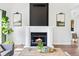 Elegant living room with fireplace, artwork, and hardwood floors at 2098 N Clarkson St, Denver, CO 80205
