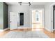 Open living room with hardwood floors, natural light, and views into other rooms at 2098 N Clarkson St, Denver, CO 80205