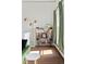 Cozy living room with hardwood floors, stylish bookshelf, and floor lamp at 2098 N Clarkson St, Denver, CO 80205