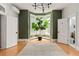Spacious living room with bay windows, hardwood floors, and natural light at 2098 N Clarkson St, Denver, CO 80205