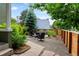 Back yard patio area with seating, landscaping, and privacy fence at 2098 N Clarkson St, Denver, CO 80205