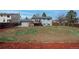 Expansive backyard featuring a wooden deck, mature trees, and ample space for outdoor activities at 3902 S Uravan St, Aurora, CO 80013