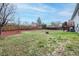 Large, fenced backyard with grass and landscaping, perfect for entertaining and outdoor enjoyment at 3902 S Uravan St, Aurora, CO 80013
