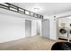 Basement with carpeted floors, neutral white walls, and a laundry area featuring a washer and dryer at 3902 S Uravan St, Aurora, CO 80013