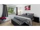 Cozy bedroom featuring a large window, comfortable bed, and stylish decor at 3902 S Uravan St, Aurora, CO 80013