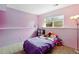 Cozy bedroom with lavender walls and carpeted floors, perfect for a or guest room at 3902 S Uravan St, Aurora, CO 80013