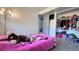Bedroom showcasing a large closet space, a window, and carpet flooring at 3902 S Uravan St, Aurora, CO 80013