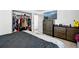Bedroom with a comfortable bed, neutral tones, dresser, and closet, creating a serene and organized space at 3902 S Uravan St, Aurora, CO 80013