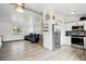Bright open-concept space combining living area and modern kitchen with seamless flow and stylish design at 3902 S Uravan St, Aurora, CO 80013