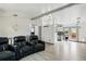 Open-concept living area with modern lighting fixtures, seamlessly connecting the living and kitchen spaces at 3902 S Uravan St, Aurora, CO 80013
