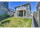 A green backyard featuring a second-story deck, ideal for relaxation and entertaining at 1086 Highlands Dr, Erie, CO 80516
