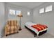 Inviting bedroom with a cozy chair and large window at 1086 Highlands Dr, Erie, CO 80516