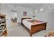 Cozy bedroom featuring an open doorway, hardwood floors and warm natural light at 1086 Highlands Dr, Erie, CO 80516