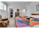 Bright bedroom featuring ensuite bath and walk-in closet at 1086 Highlands Dr, Erie, CO 80516