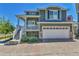 Two-story home with a two-car garage and brick driveway at 1086 Highlands Dr, Erie, CO 80516