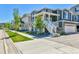 Street view of an attractive suburban home with a white porch and green lawn at 1086 Highlands Dr, Erie, CO 80516