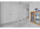 Spacious hallway with carpet, access to several rooms, and ample storage at 1086 Highlands Dr, Erie, CO 80516