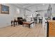 Inviting living room with comfortable seating and views of the modern kitchen, all bathed in natural light at 1086 Highlands Dr, Erie, CO 80516