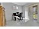 Bright office space with sliding glass doors and a large work desk at 1086 Highlands Dr, Erie, CO 80516