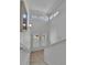 Bright stairway leading to upper level, with white walls, shutters, and light wood floors at 1086 Highlands Dr, Erie, CO 80516