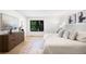 Serene bedroom with a large window, hardwood floors, and neutral decor for a peaceful retreat at 7308 S Steele Cir, Centennial, CO 80122