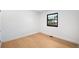 Neutral bedroom with a large window showing a treed exterior at 7308 S Steele Cir, Centennial, CO 80122