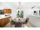 Bright kitchen with light wood cabinets and adjacent breakfast nook at 7308 S Steele Cir, Centennial, CO 80122
