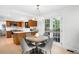 Bright kitchen with light wood cabinets and adjacent breakfast nook at 7308 S Steele Cir, Centennial, CO 80122