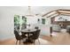 Open floor plan kitchen overlooks the living room with fireplace and vaulted ceilings at 7308 S Steele Cir, Centennial, CO 80122