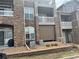 Apartment building exterior with stone accents, multiple levels of patios, and well maintained landscape at 7440 S Blackhawk St # 2-106, Englewood, CO 80112