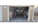 Single car garage, filled with stuff, but has good storage solutions at 7440 S Blackhawk St # 2-106, Englewood, CO 80112