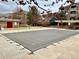 Community swimming pool covered for the off-season, surrounded by trees and residential buildings at 7440 S Blackhawk St # 2-106, Englewood, CO 80112
