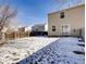 Large backyard with a wooden fence, partially covered in snow at 269 Ponderosa Pl, Fort Lupton, CO 80621