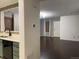 View of living room from kitchen, showing hardwood floors at 269 Ponderosa Pl, Fort Lupton, CO 80621