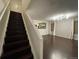 Dark wood staircase leading to the upper level of the home at 269 Ponderosa Pl, Fort Lupton, CO 80621