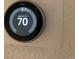 Smart thermostat, Nest brand, digital display, set to 70 degrees at 269 Ponderosa Pl, Fort Lupton, CO 80621