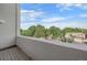 Relaxing balcony view showcases a mix of lush greenery and neighborhood charm under a clear blue sky at 1655 N Williams St, Denver, CO 80218