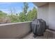 Enjoy outdoor grilling on a covered balcony with views of lush trees and neighborhood tranquility at 1655 N Williams St, Denver, CO 80218