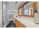 Chic bathroom featuring a white vanity, modern mirrors, and a stylish shower with beautiful tile at 1655 N Williams St, Denver, CO 80218