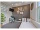 Cozy bedroom with a stylish gray accent wall, streamlined desk, and bright decor at 1655 N Williams St, Denver, CO 80218