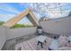 Cozy rooftop deck with an outdoor seating area, grill, and great views of the surrounding neighborhood at 1655 N Williams St, Denver, CO 80218