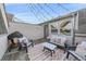 Rooftop deck features cozy seating, string lights, and a grill for a great outdoor living space at 1655 N Williams St, Denver, CO 80218