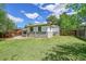 A well-maintained backyard with a lush lawn and privacy fencing at 495 Quebec St, Denver, CO 80220