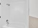 The renovated bathroom is all white with white subway tiles at 495 Quebec St, Denver, CO 80220