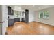 Open concept kitchen and dining room with lots of light, stainless steel appliances and hardwood floors at 495 Quebec St, Denver, CO 80220